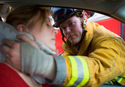 Photo of a Firefighter Rescuing a Women